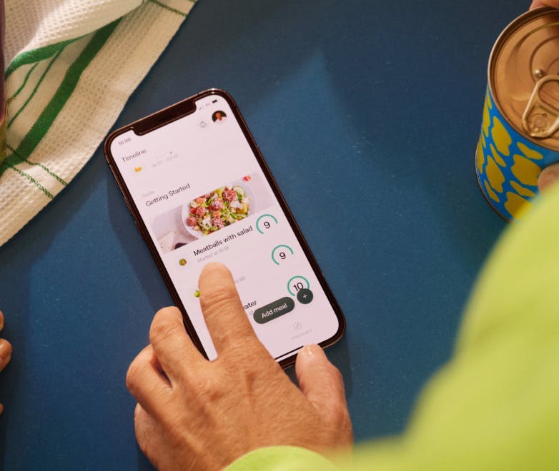 A person logs a meal in the Veri app on their mobile phone.