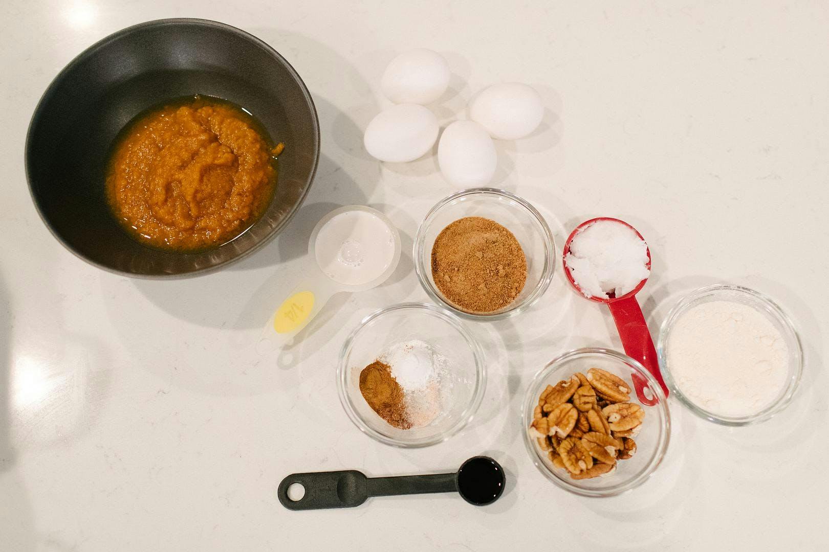 coconut pecan pumpkin muffin ingredients laid out side by side