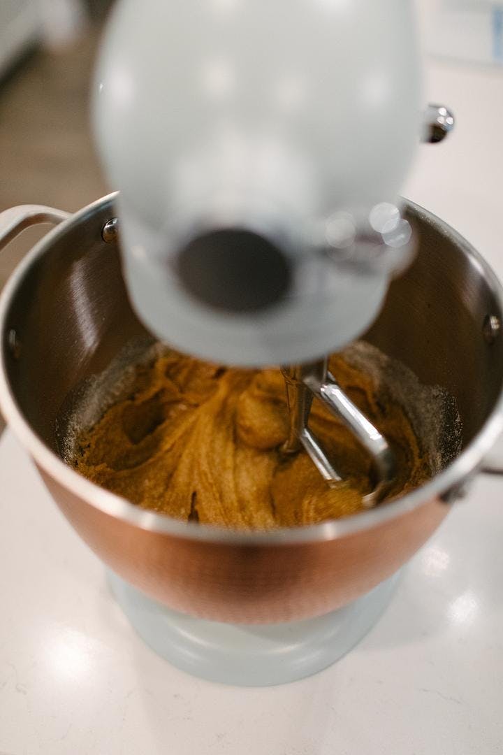 muffin batter being mixed in a stand mixer