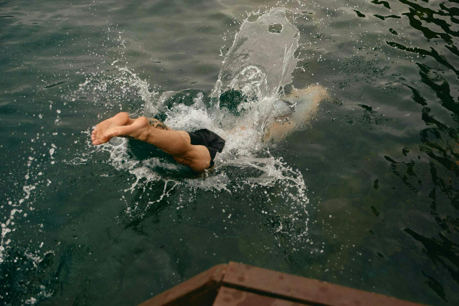 man diving into water