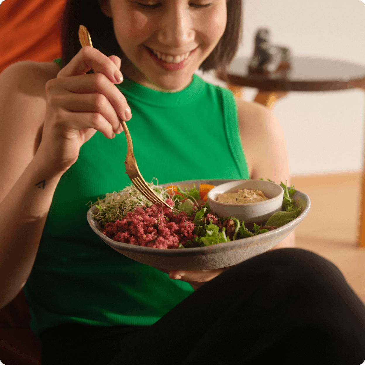 woman eating blood sugar friendly salad
